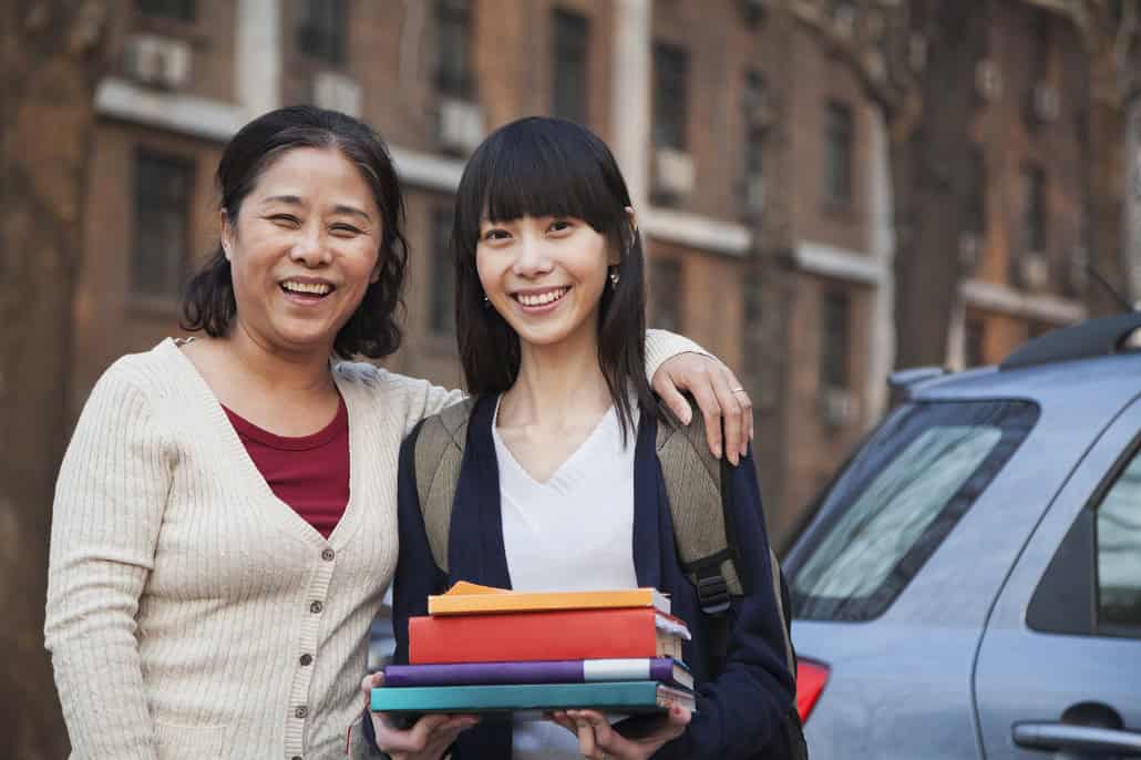 Creative Ways to Save on College Costs Mother and daughter moving into college