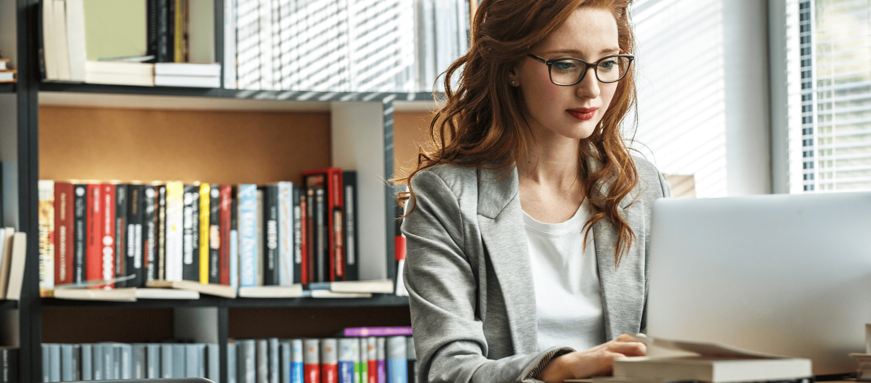College Admin Hero Woman using laptop